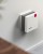Der FRITZ!Repeater 1200 an einer Wand im Innenraum, gestaltet von Mehnert Corporate Design.