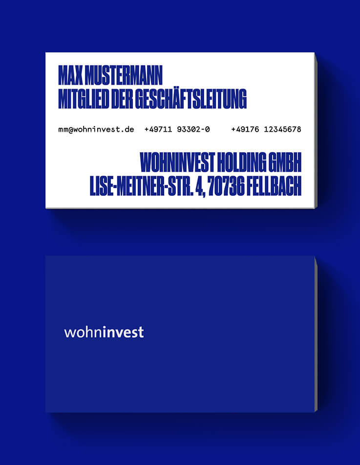 This picture shows the newly designed business card of Wohninvest Holding GmbH.
