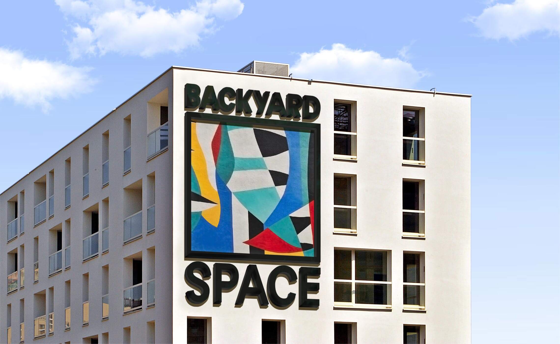 In this picture, the logo can be seen on the facade of the Backyard Space.