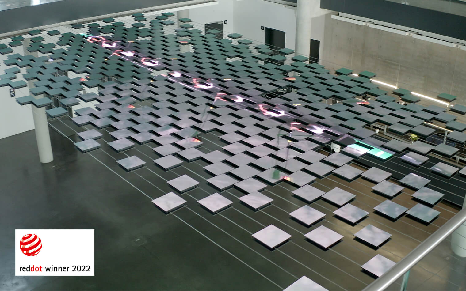 Digital art installation Wilo Connected from above with the Red Dot Award 2022 logo and the representation of the Germany Eight.