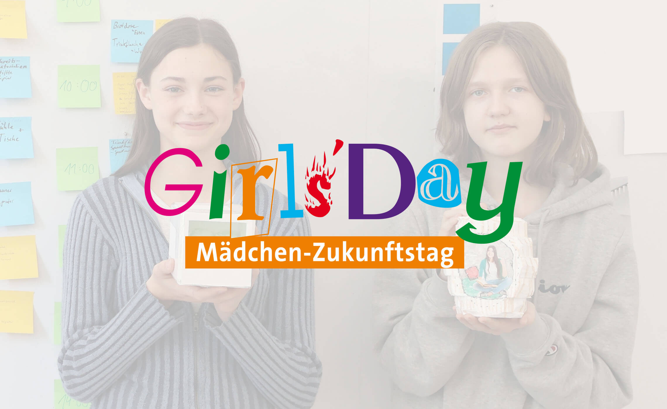 The students with the result of their work and the Girls Day logo