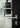 Black square stickers on the glass pane of a door with instructions for using the electronic door, in the design of the signage created by Mehnert Corporate Design for Wilo.