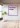 Concrete wall in a building with a section label in the corporate design of the Wohninvest Backyard Space.
