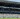 Voll besetztes Stadion während eines Spiels, Elemente des Corporate Design des Wohninvest Weserstadions sind im Hintergrund zu erkennen.